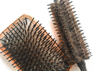 Dirty Hair Brushes on white background close up photo