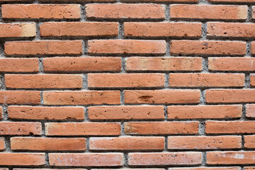 Red brick wall background. Old wall with grey cement.