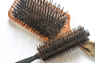 Dirty Round Hair Brush on white background close up photo