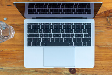 laptop on a wooden table