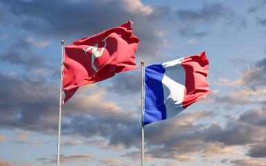 Beautiful national state flags of the Isle of Mann and France together at the sky background. 3D artwork concept.