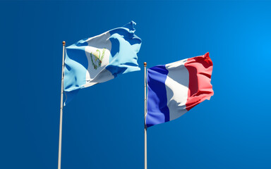 Beautiful national state flags of Guatemala and France together at the sky background. 3D artwork concept.