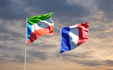 Beautiful national state flags of Equatorial Guinea and France together at the sky background. 3D artwork concept.