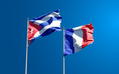 Beautiful national state flags of Cuba and France together at the sky background. 3D artwork concept.