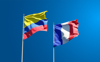 Beautiful national state flags of Colombia and France together at the sky background. 3D artwork concept.
