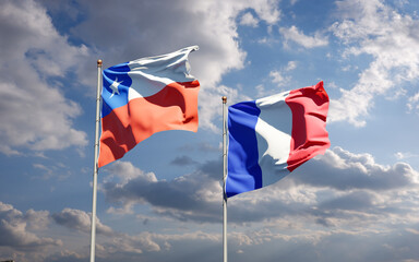 Beautiful national state flags of Chile and France together at the sky background. 3D artwork concept.