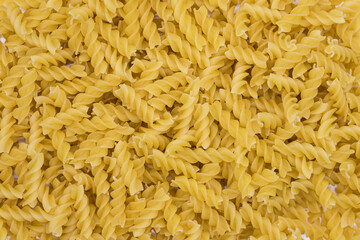 Tasty Fusilli pasta background. Healthy food textures