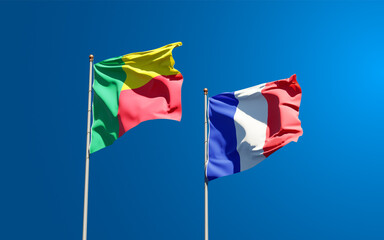 Beautiful national state flags of Benin and France together at the sky background. 3D artwork concept.