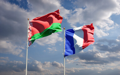 Beautiful national state flags of Belarus and France together at the sky background. 3D artwork concept.