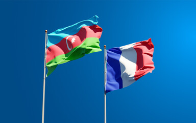 Beautiful national state flags of Azerbaijan and France together at the sky background. 3D artwork concept.