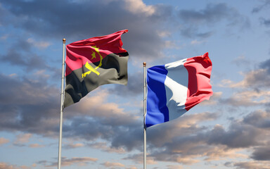 Beautiful national state flags of Angola and France together at the sky background. 3D artwork concept.