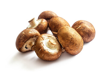 Few freshly cut champignons, with brown caps on white