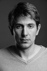 Portrait of handsome man against gray background