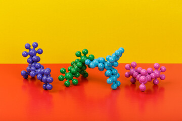 Dna molecule toy for kids on colored background