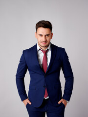 Young man poses head-on with elegance