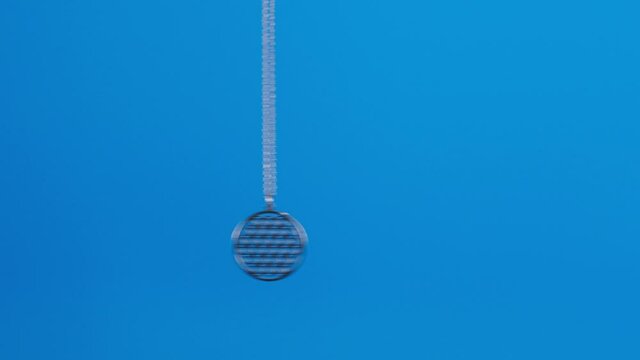 The flower of life necklace dangles ,swings to right and left and hypnotizes.
