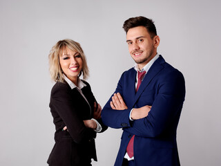 Business personnel are shown smiling and with positive and confident aptitude