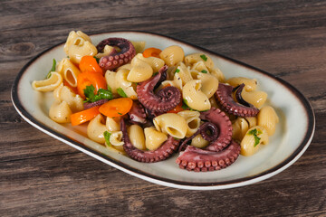 Pasta with octopus and yellow tomatoes