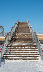 stairs for crossing railway tracks in winter
