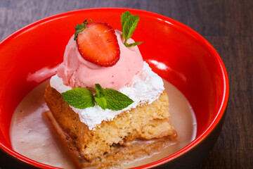 Cake with ice cream served stravberry