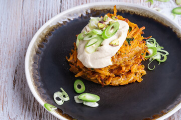 Sweet potato fritters.with hummus and pistachios