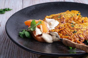 Sweet potato fritters.with hummus and smoked salmon