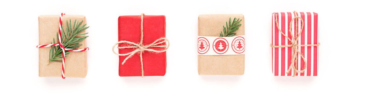 Christmas gift composition. New year flatly with red dotted and craft gifts at grey background. Xmas concept.