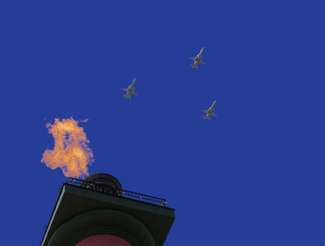 Russian military aircraft in the blue sky with rastral columns of St. Petersburg