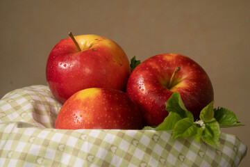 red apples in a basket autumn time