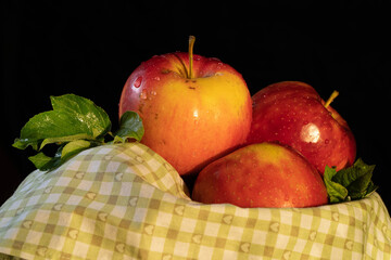 red apples in a basket autumn time
