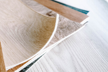 Linoleum cut into pieces. Samples of flooring in a bundle.