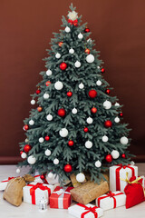 Christmas tree with gifts New Year scenery room red