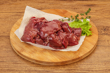 Raw chicken liver over board