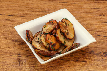 Roasted champignon with herbs and spices