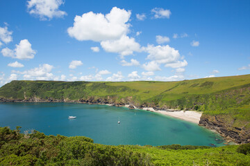 Fototapeta na wymiar Secluded beach at Lantic Bay Cornwall England near Fowey and Polruan with turquoise and blue sea on a beautiful summer day