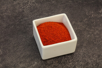 Dry paprika powder in the bowl