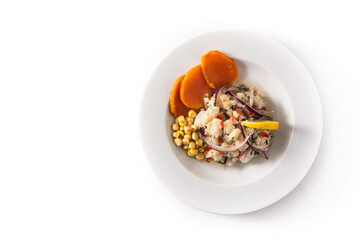 Traditional peruvian ceviche with fish, sweet potato, corn and vegetables isolated on white background.Top view.Copy space	