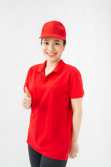 A portrait of Happy Female delivery service showing thumb up