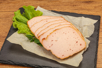 Boiled pork sausage over board