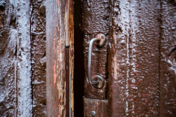 old rusty metal handle and door