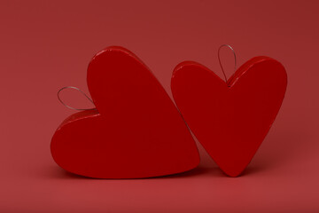 Two heart shape gift boxes on pink background