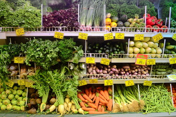 Local vegetables with price tags in grocery supermarket. Kandy, Sri Lanka