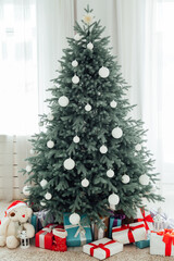 Door opening into a beautiful living room decorated for Christmas