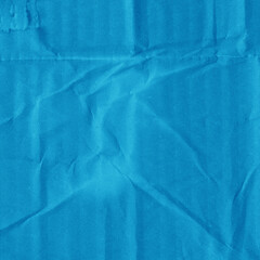 A blue vintage rough sheet of carton. Recycled environmentally friendly cardboard paper texture. Simple minimalist papercraft background.