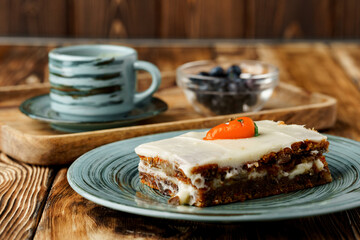 Slice of carrot cake on green plate
