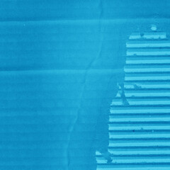 A blue vintage rough sheet of carton. Recycled environmentally friendly cardboard paper texture. Simple minimalist papercraft background.