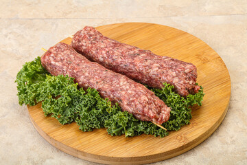 Raw minced beef kebab skewer