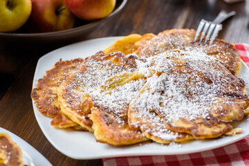 homemade pancakes with apples poured with honey.