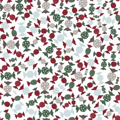 Seamless Christmas pattern. Pattern with multicolored candies on a white isolated background