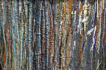 Obraz premium Volumetric drops of multi-colored paint spread along the wall as a background